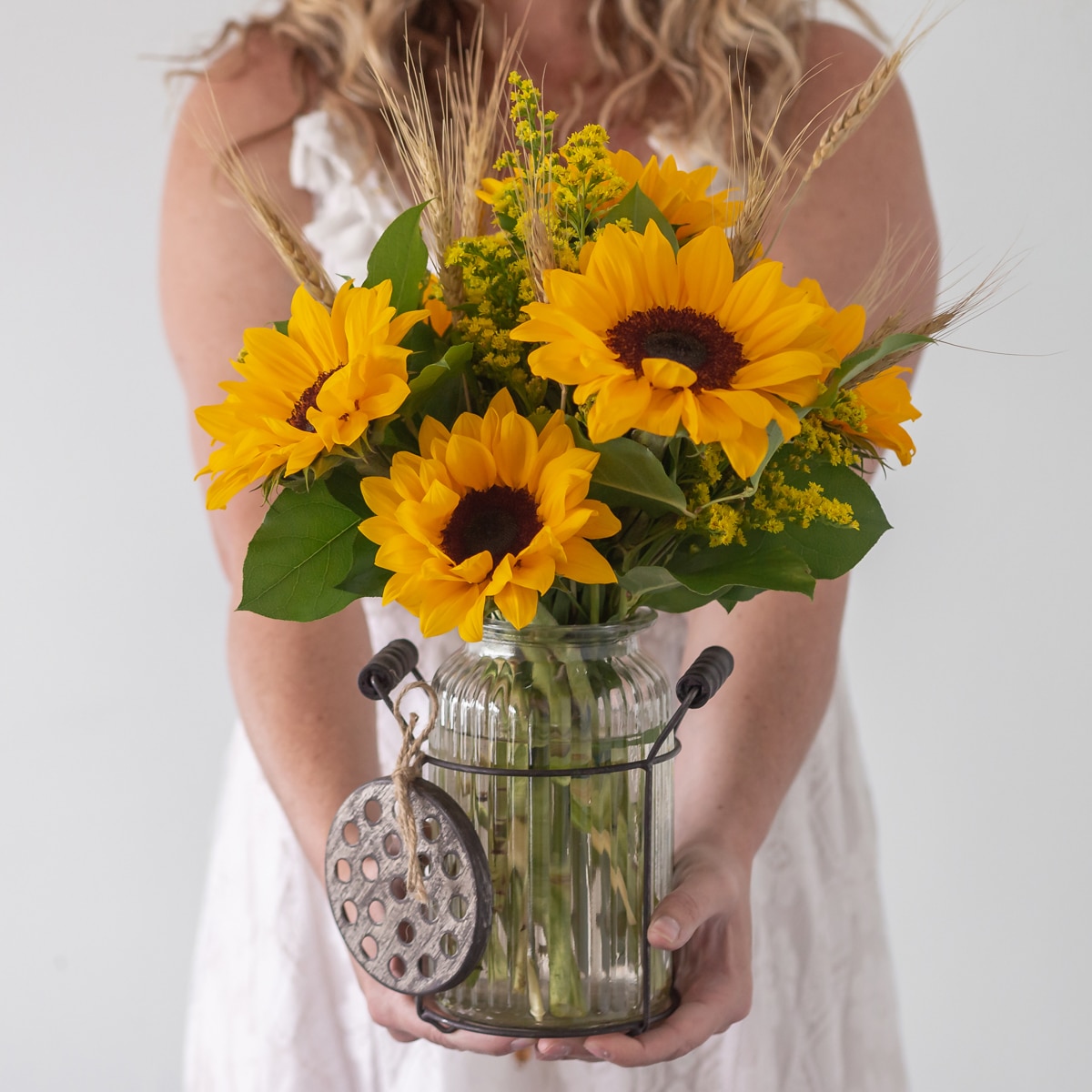 Yellow sunflowers fresh-cut arranged in a vase.