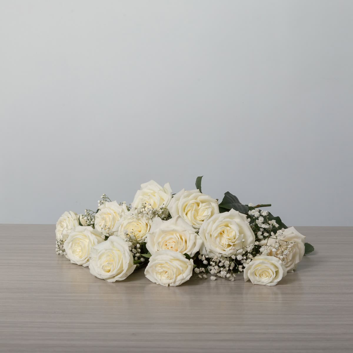 Playa Blanca Roses (12 roses, Arranged cut bouquet, With greenery and floral accents)