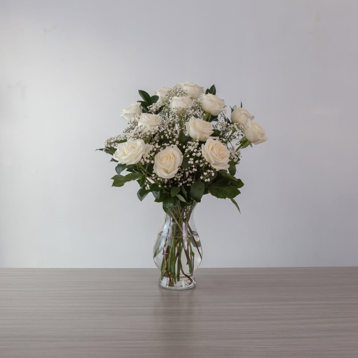Playa Blanca Roses (12 roses, Arranged bouquet in vase, With greenery and floral accents)
