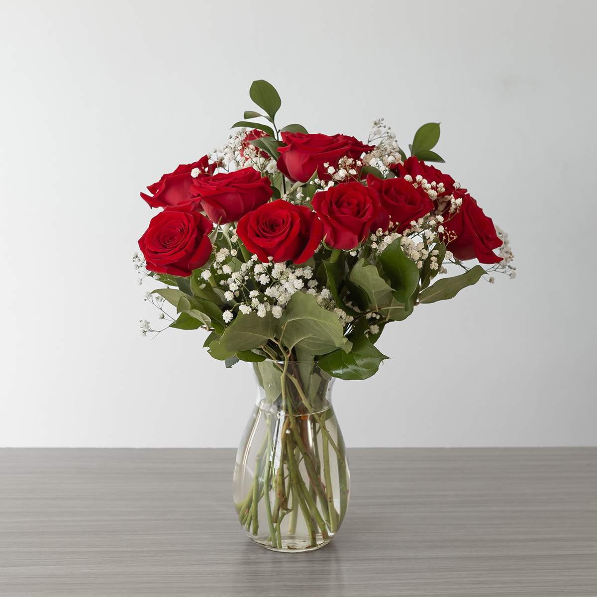 Short Stem Red Roses (12 roses, Arranged bouquet in vase, With greenery and floral accents)