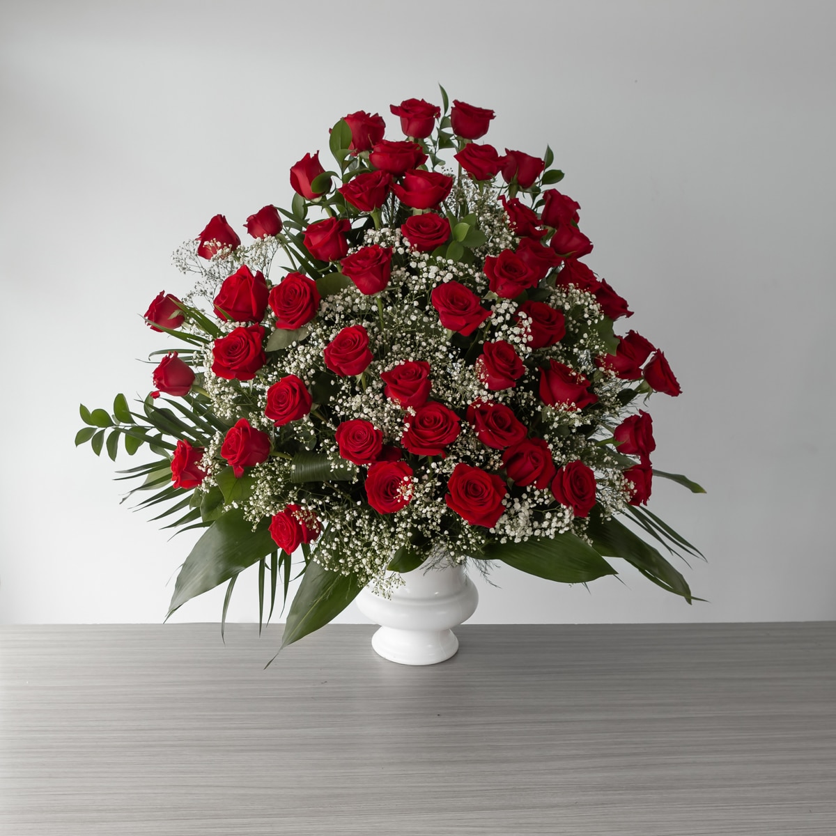 Red Roses Abundance (48 roses, With greenery and floral accents)