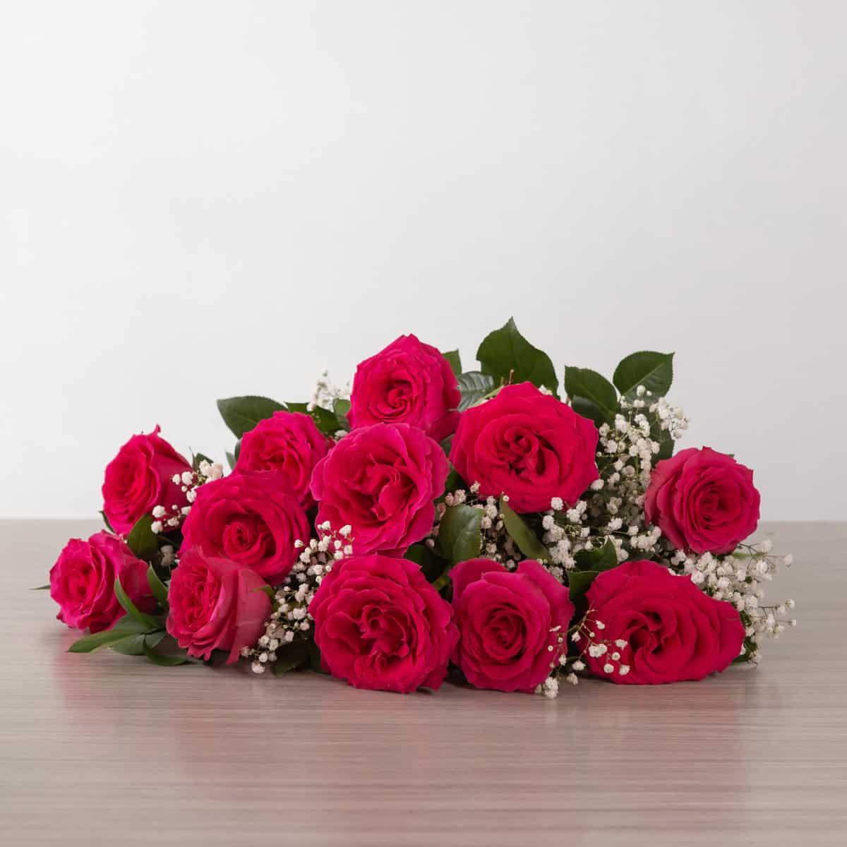 Full Monty Roses (12 roses, Arranged cut bouquet, With greenery and floral accents)