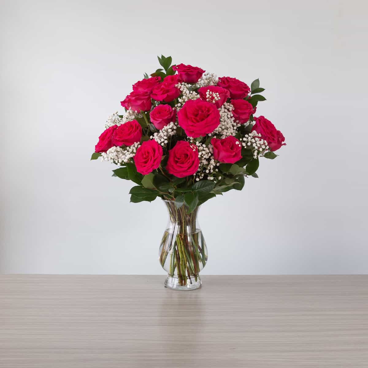 Full Monty Roses (24 roses, Arranged bouquet in vase, With greenery and floral accents)