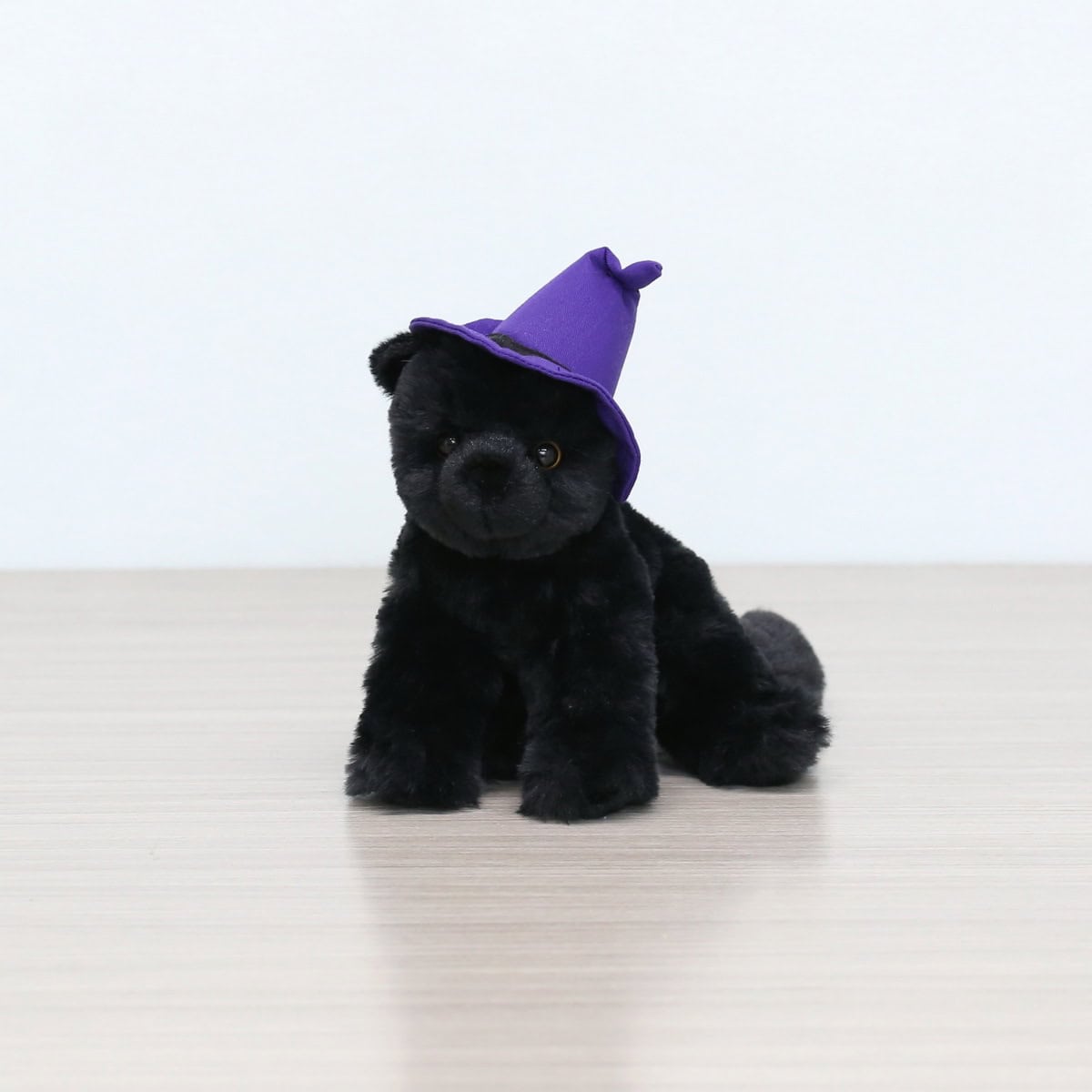 Add a touch of Halloween magic with our black cat plush wearing a purple witch hat. Perfect for floral arrangements, gifts, or seasonal decorations. Available at Le Bouquet.