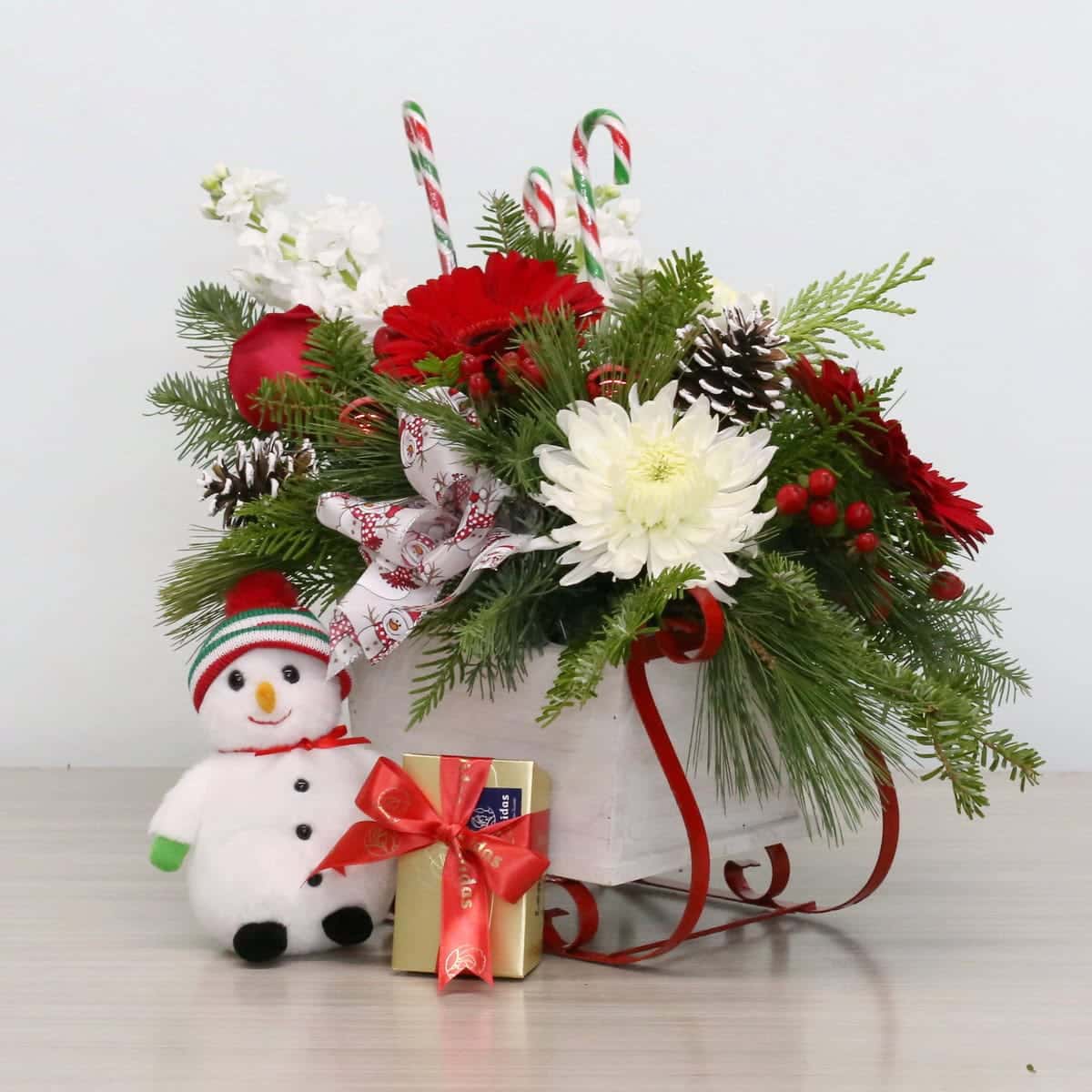 Holiday Sleigh Surprise – Christmas Floral Arrangement