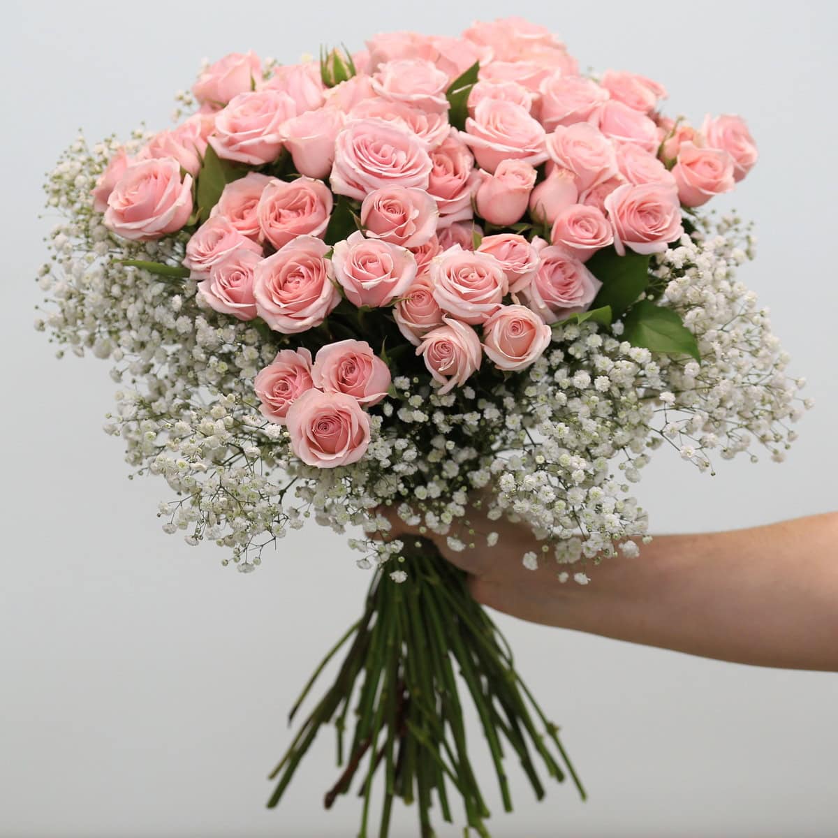 Aurora arrangement with pink spray roses and baby's breath