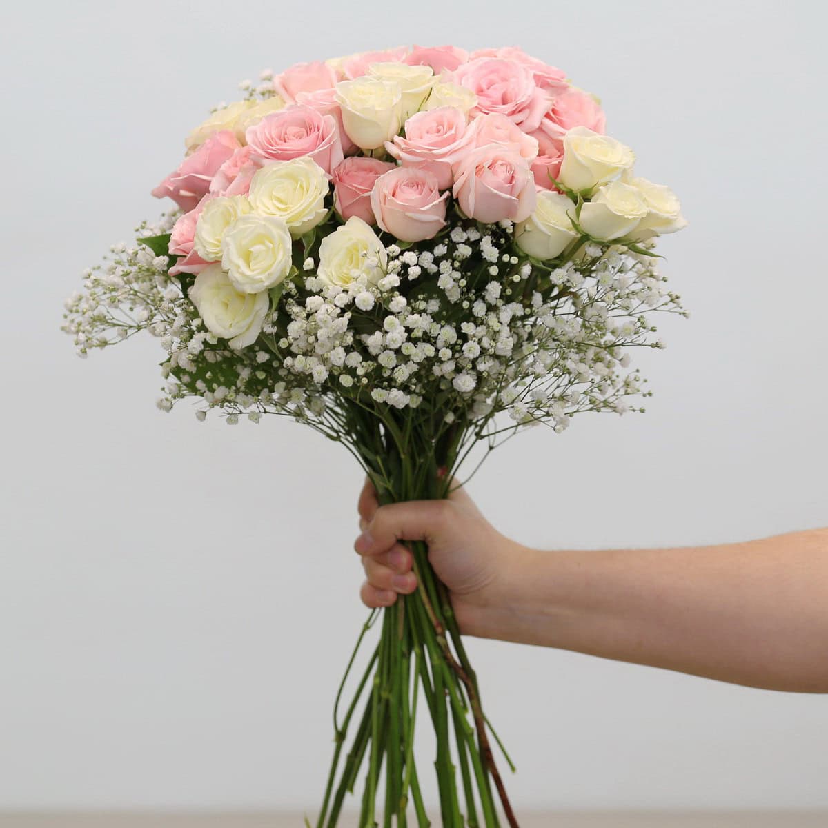 Aurora arrangement with pink and white spray roses and baby's breath
